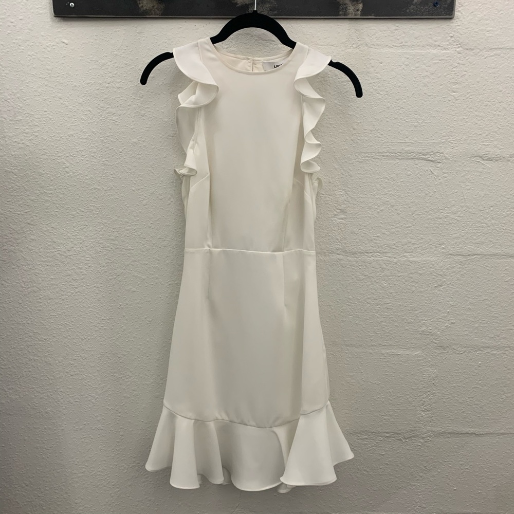 Likely "Fanning" dress with ruffle trim
